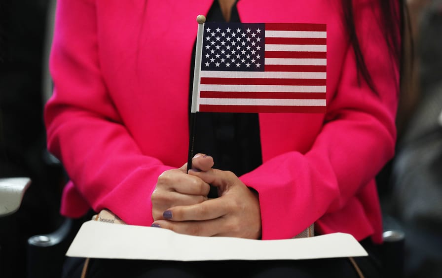 immigration-us-flag-woman-gty-img