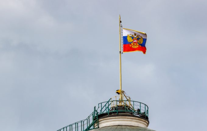 Russian flag with Coat of arms of Russia. Kremlin presidential