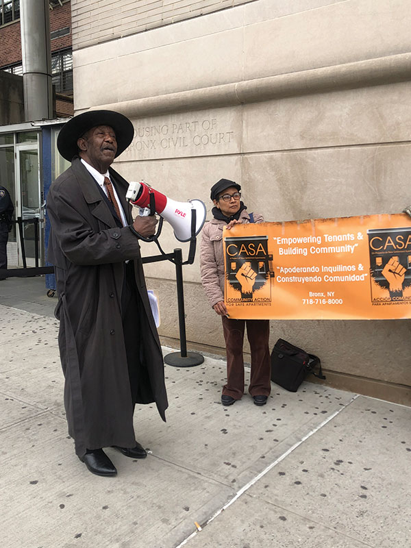 Julius Bennett (left) and his fellow tenants from 1230 Woodycrest Avenue outside Bronx Housing Court in April 2023.