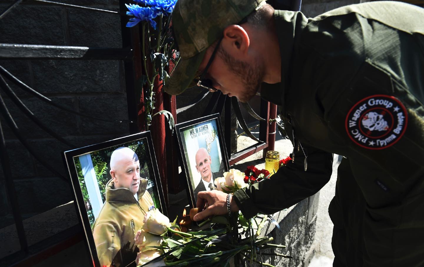 wagner mercenary group soldier at memorial for yevgeny priogzhin