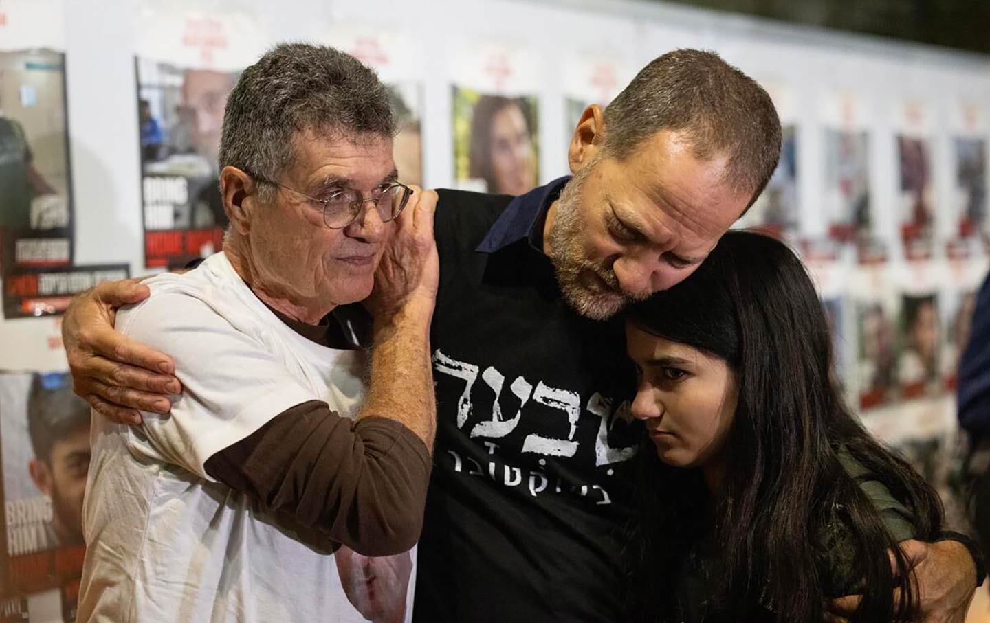 Yaacov Godo (left) and Maoz Inon (center) at a gathering of the families of hostages and survivors.