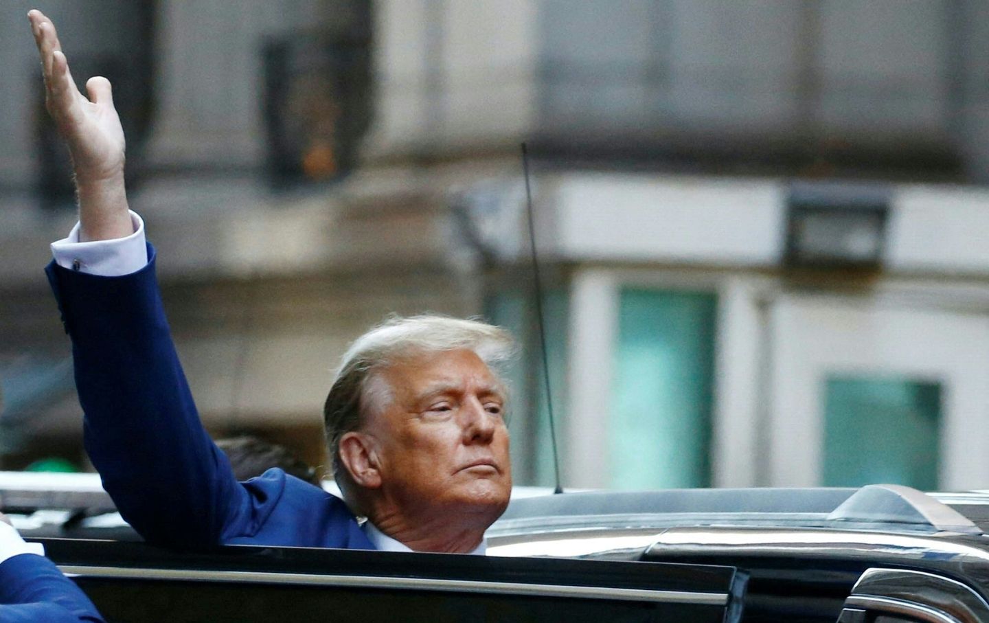 Former US President Donald Trump departs after speaking to the press after attending the civil fraud trial against the Trump Organization in New York State Supreme Court, in New York City on January 11, 2024.