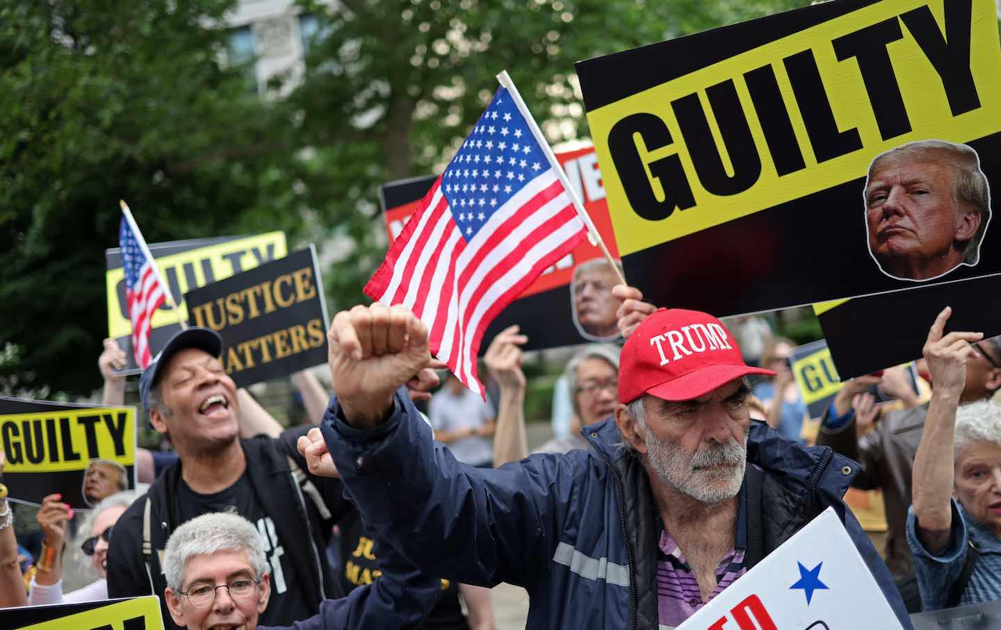 People react after former US president and Republican presidential candidate Donald J. Trump was sentenced in a criminal trial outside Manhattan Criminal Court in New York City on May 30.
