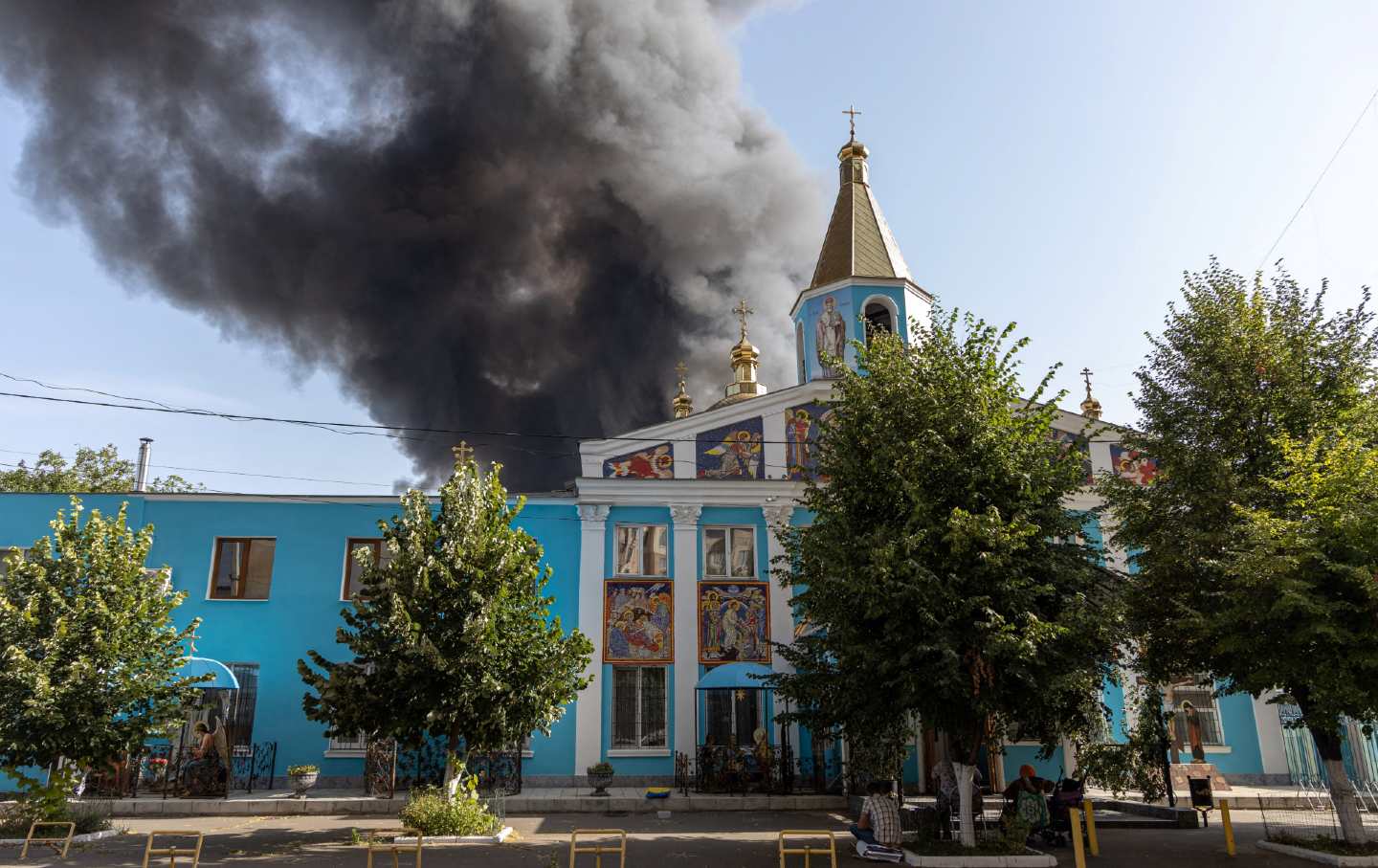 Smoke rises behind the Holy Sritenska church following a Russian missile strike in Odesa, Ukraine on June 24, 2024.