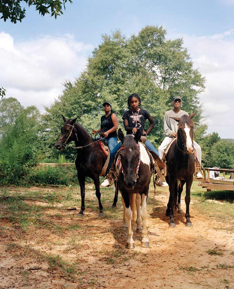 LaToya Ruby Frazier’s “Zion, Her Mother Shea, and Her Grandfather Mr. Smiley Riding on Their Tennessee Walking Horses, Mares, P.T. (P.T.’s Miss One of a Kind), Dolly (Secretly), and Blue (Blue’s Royal Threat), Newton, Mississippi.”