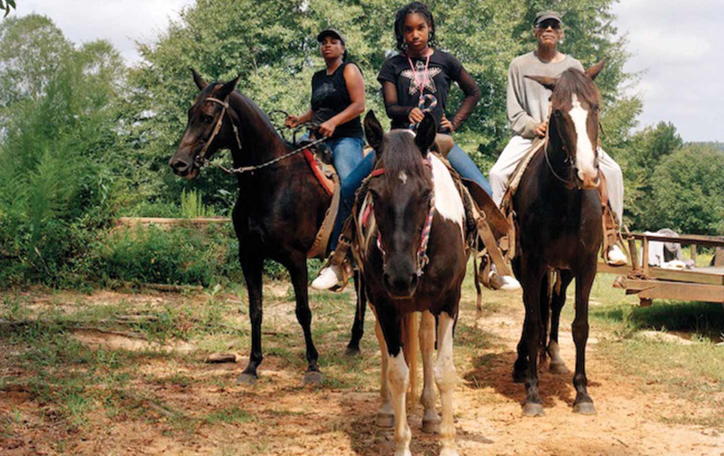 LaToya Ruby Frazier’s “Zion, Her Mother Shea, and Her Grandfather Mr. Smiley Riding on Their Tennessee Walking Horses, Mares, P.T. (P.T.’s Miss One of a Kind), Dolly (Secretly), and Blue (Blue’s Royal Threat), Newton, Mississippi.”
