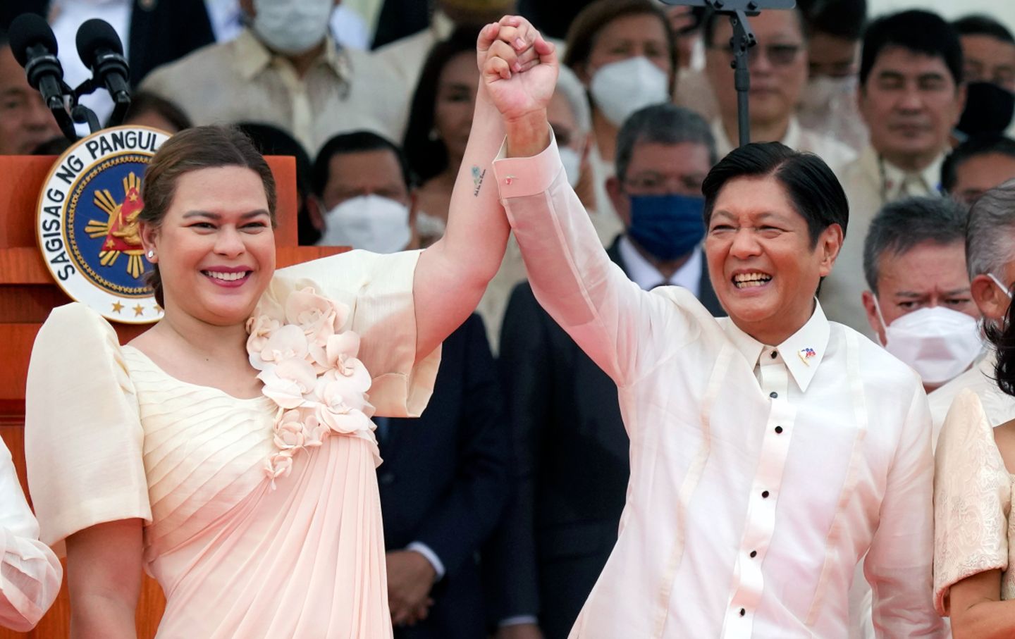 Ferdinand Marcos Jr. and Sara Duterte celebrate during their inauguration ceremony on June 30, 2022, in Manila.