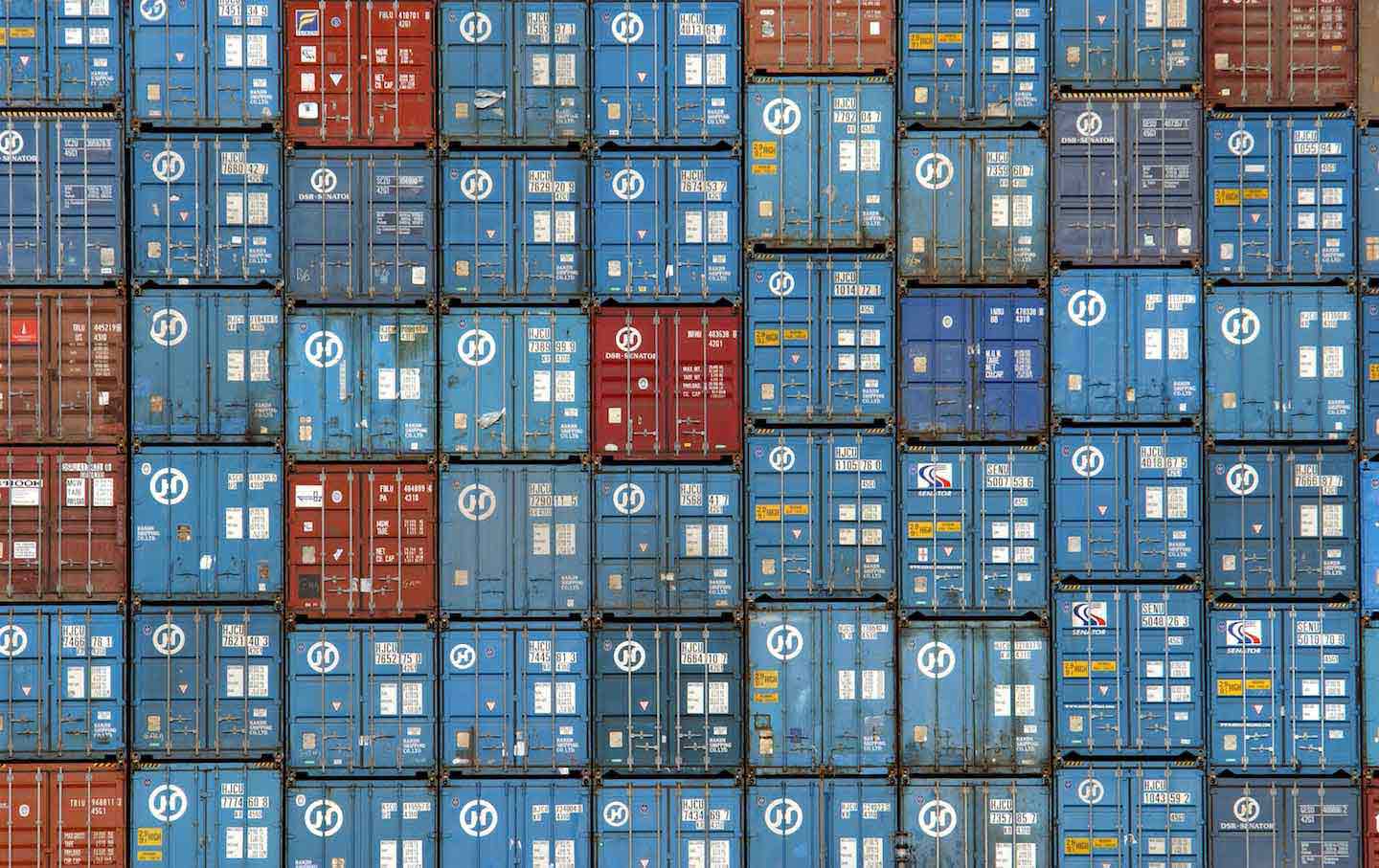 Thousands of truck-sized 30-ton shipping containers are stacked aboard the Hanjin Oslo freighter in the Port of Los Angeles, 2020.