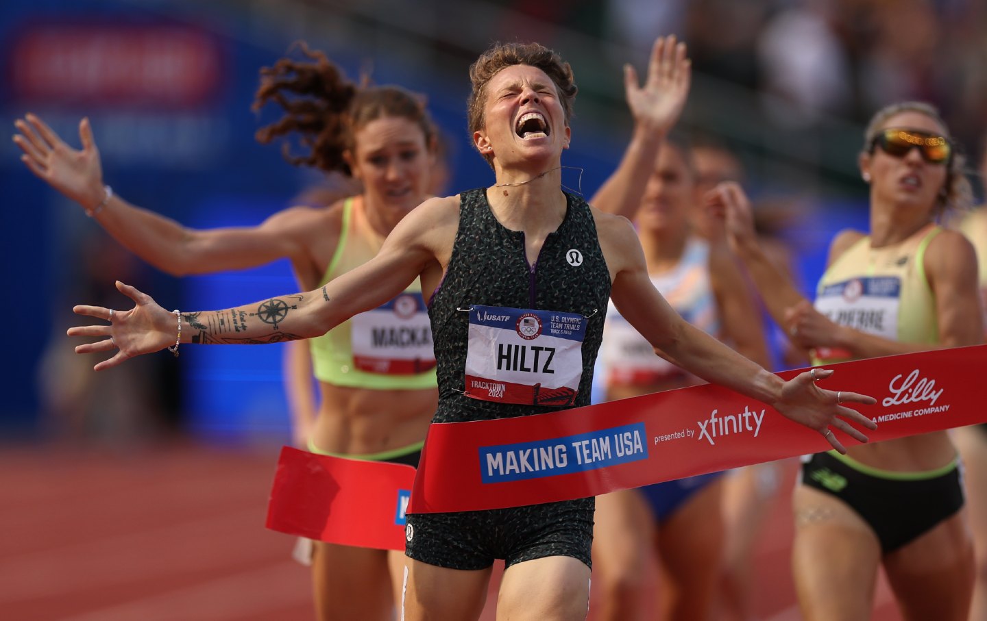 Nikki Hiltz celebrates crossing the finish line to win the women's 1500 meter final at the 2024 US Olympic Team Track & Field Trials at Hayward Field on June 30, 2024 in Eugene, Oregon.