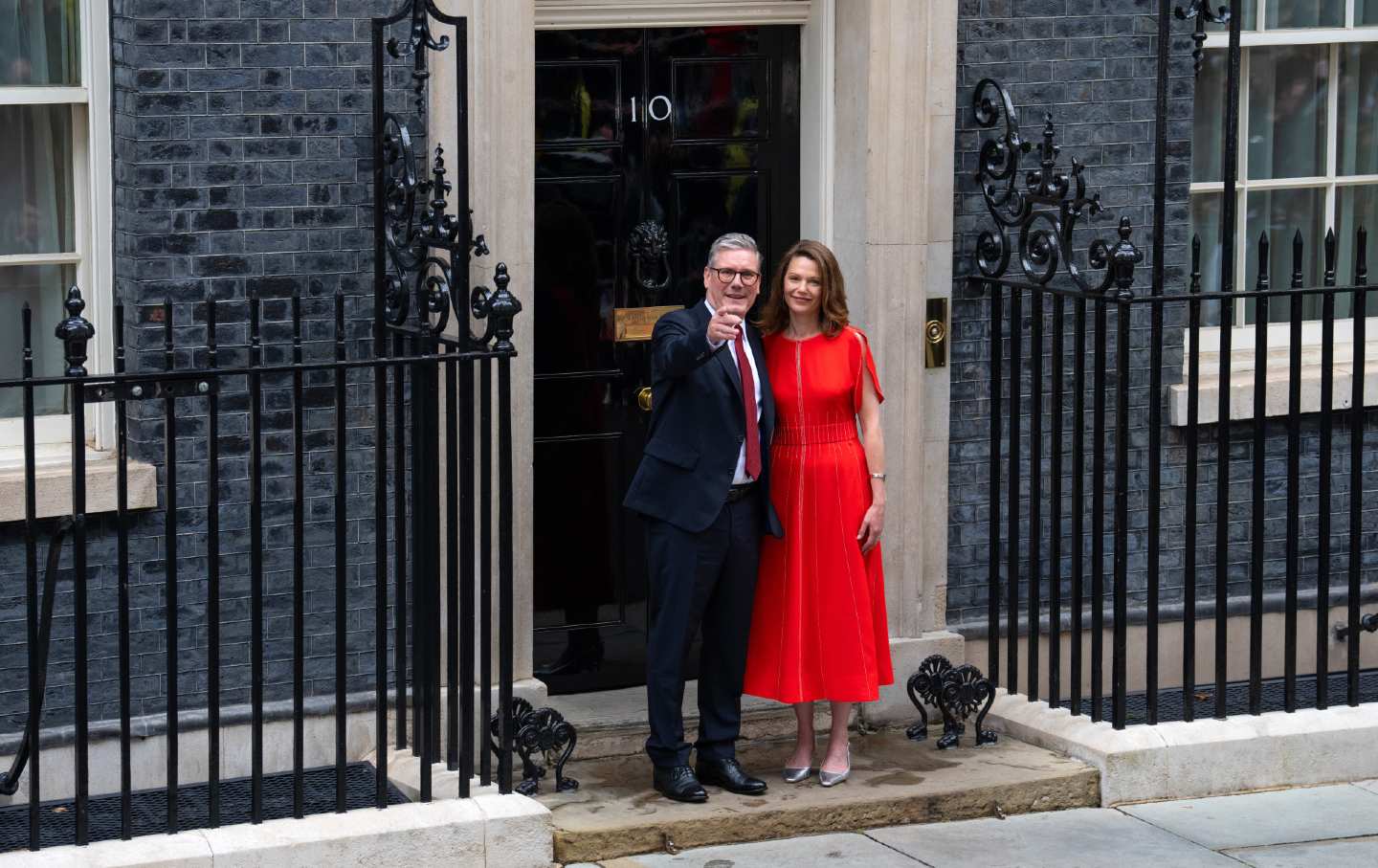 This image has an empty alt attribute; its file name is keir-starmer-point-getty.jpg Labour leader and incoming Prime Minister Sir Keir Starmer and his wife, Victoria, Lady Starmer, enter 10 Downing Street following Labour's landslide election victory on July 5, 2024, in London.