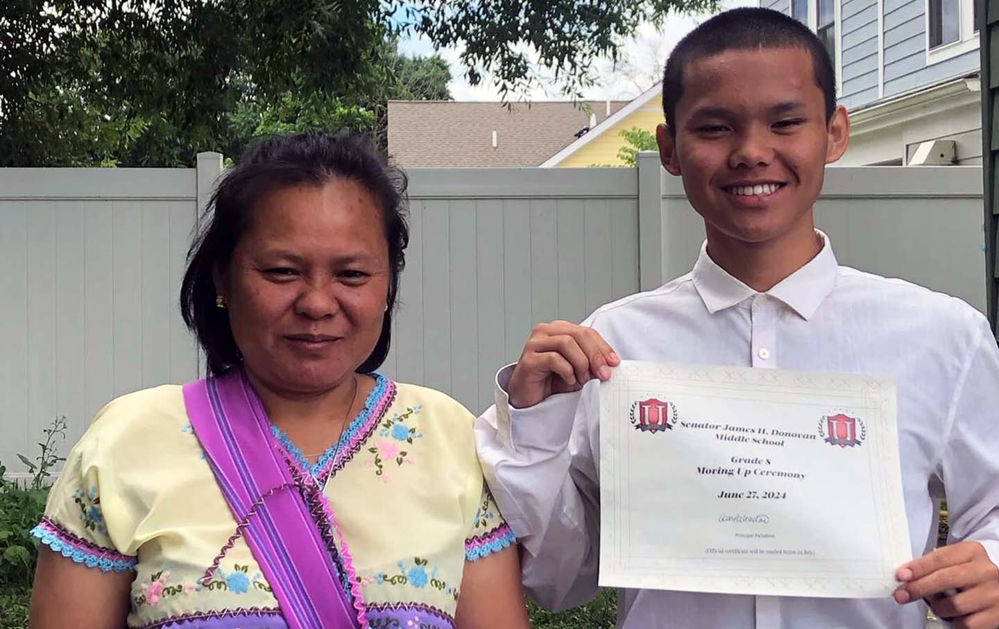 Nyah Mway and his mother, Chee War, celebrate Mway's graduation from middle school on June 27, 2024, the day before Utica police killed him.