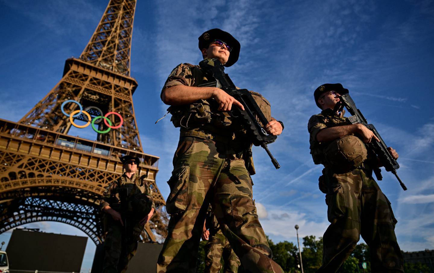 French soldiers stand guard near to Eiffel Tower in Paris on July 21 ahead of the Paris 2024 Olympic and Paralympic Games.