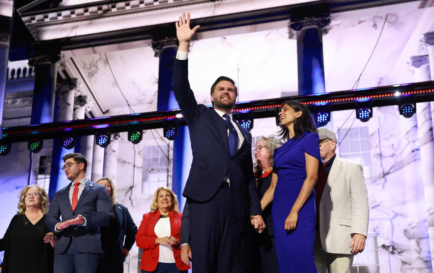J.D. Vance, his wife, Usha (in the blue dress), and his family on stage in Milwaukee. His mother Bev, a former addict whom Vance described last night as “10 years clean and sober,” is on the left.