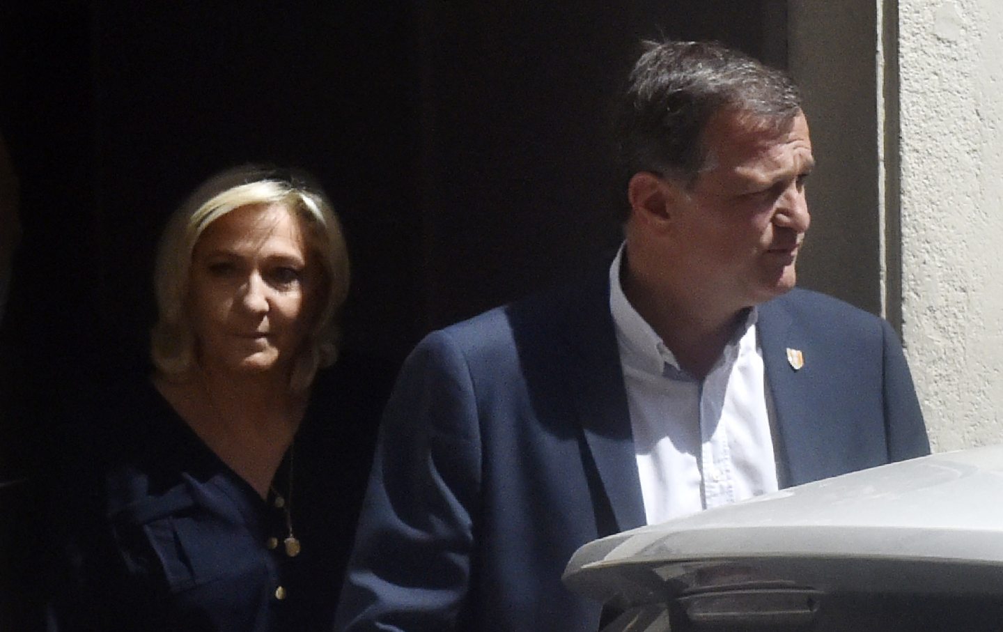 Marine Le Pen and Perpignan mayor Louis Aliot leave Perpignan's city hall on July 3, 2021.