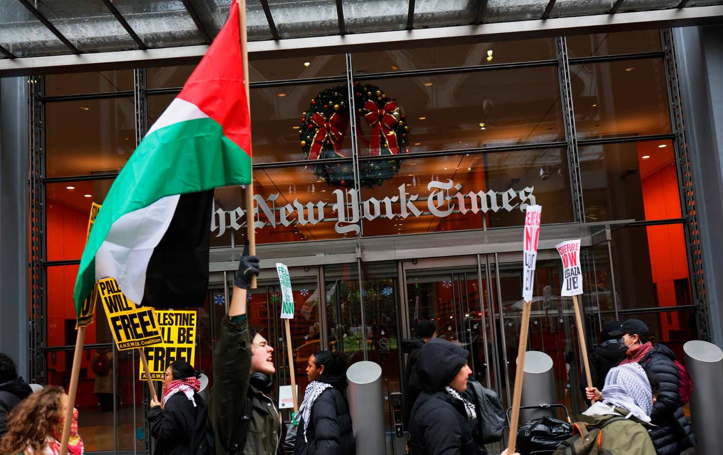 Pro-Palestinian protesters gather on December 11, 2023, outside of the New York Times building in New York City to protest the newspaper’s coverage of the Israel-Gaza war.