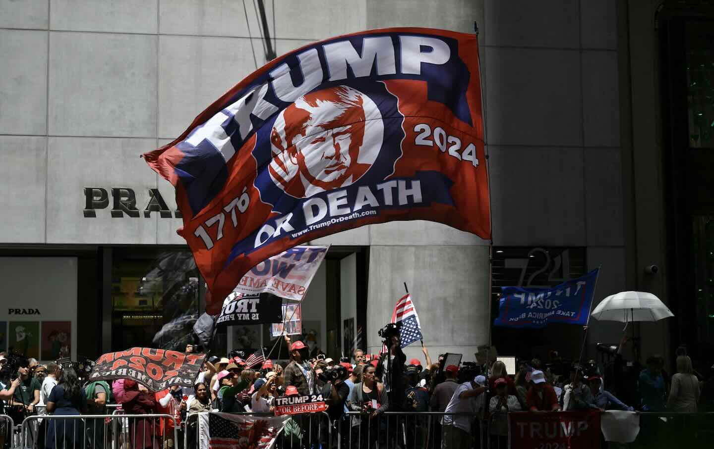 A Trump-themed flag is flown by supporters across the street from Trump Tower as former President and Republican presidential candidate Donald Trump holds a press conference after being found guilty over hush-money charges on May 31, 2024.