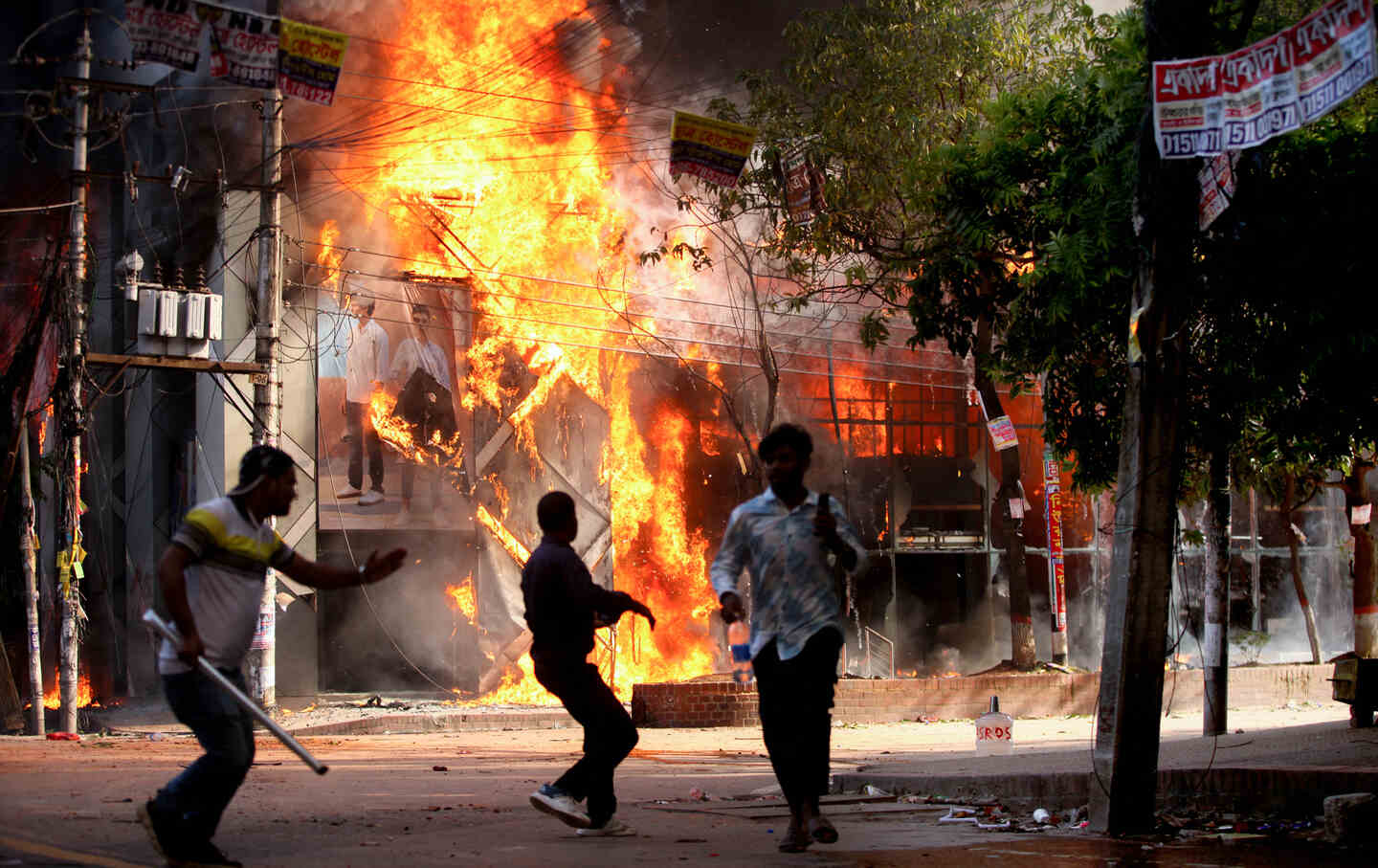 A garment store is set ablaze in Dhaka on August 4, 2024.