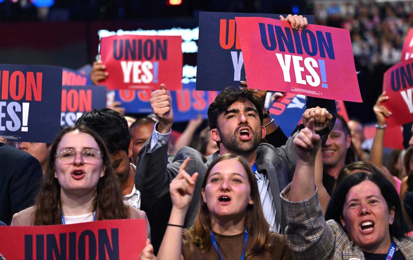 Attendees chant “Donald Trump is a scab” on the first day of the Democratic National Convention at the United Center in Chicago on August 19, 2024.