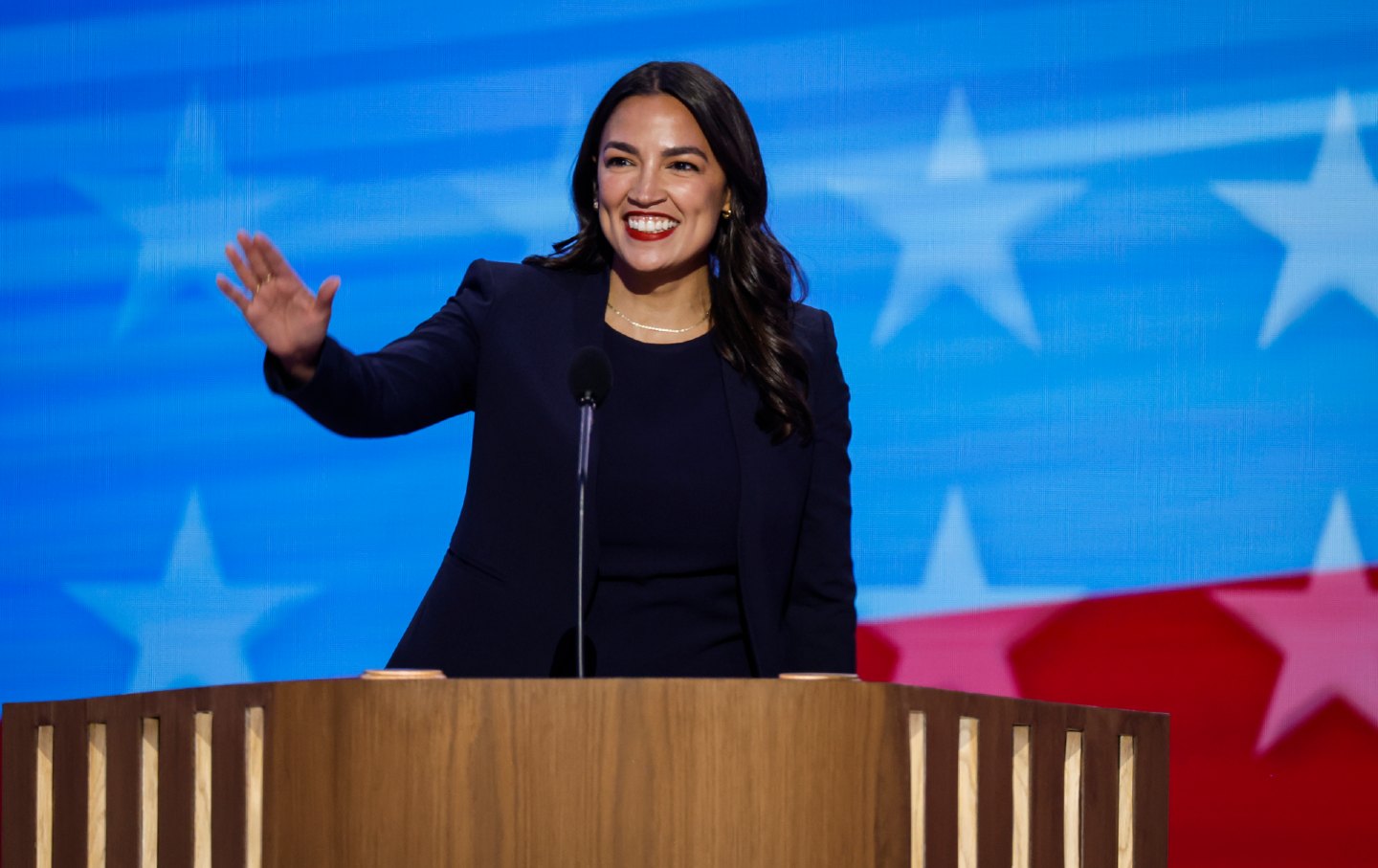 Representative Alexandria Ocasio-Cortez of New York speaks onstage during the first day of the Democratic National Convention at the United Center on August 19, 2024, in Chicago.