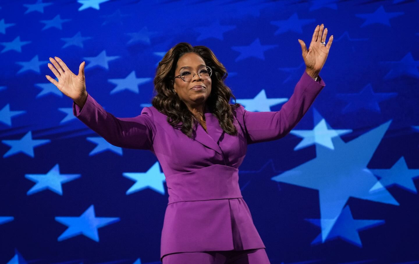 Oprah Winfrey departs after speaking on stage during the third day of the Democratic National Convention at the United Center on August 21 in Chicag