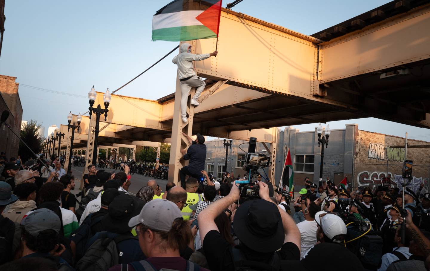 Demonstrators march in protest to the war in Gaza near the United Center where the Democratic National Convention (DNC) is taking place on August 21, 2024 in Chicago, Illinois.