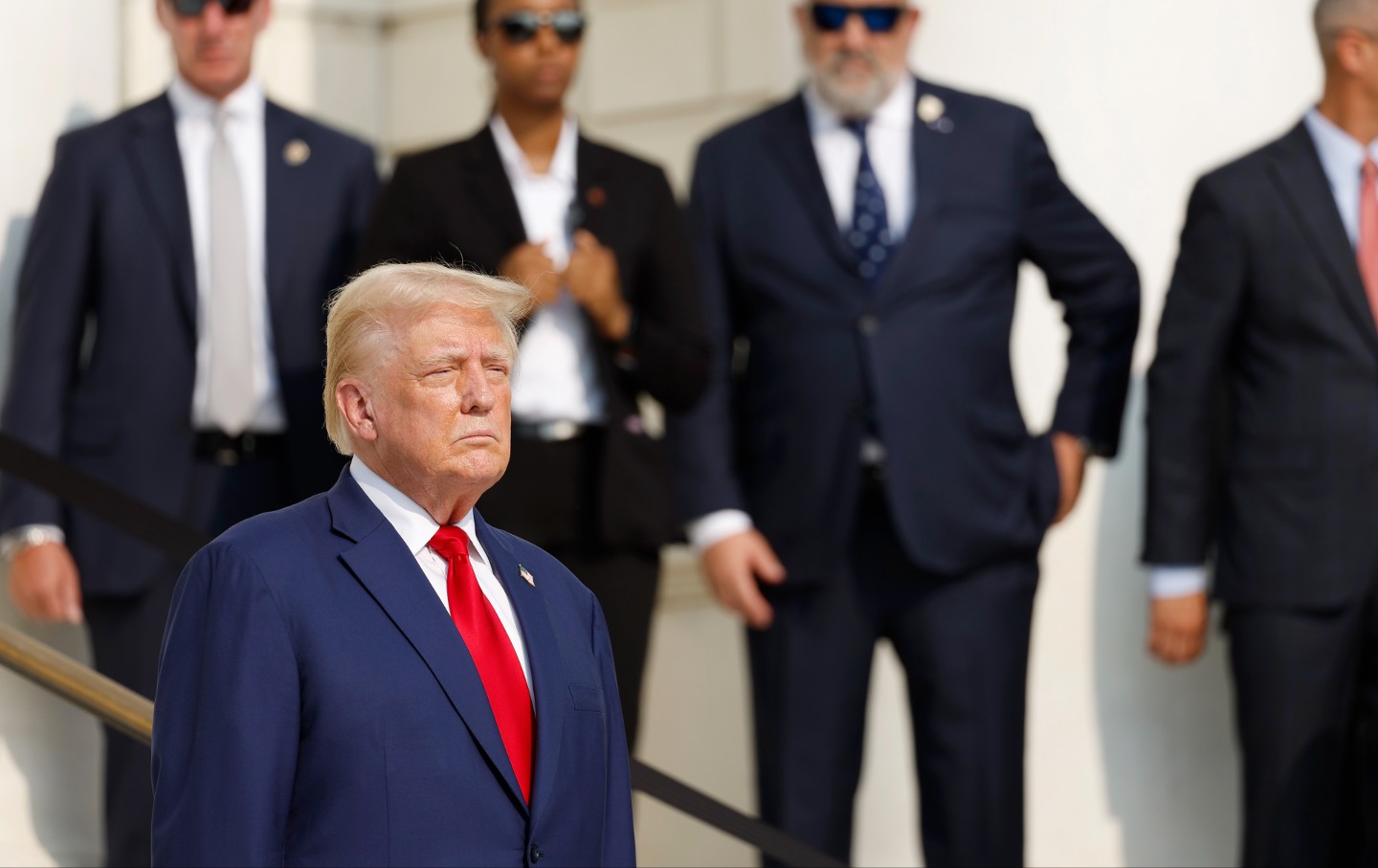 Donald Trump looks on during a wreath-laying ceremony at the Tomb of the Unknown Soldier at Arlington National Cemetery on August 26, 2024, in Arlington, Virginia.