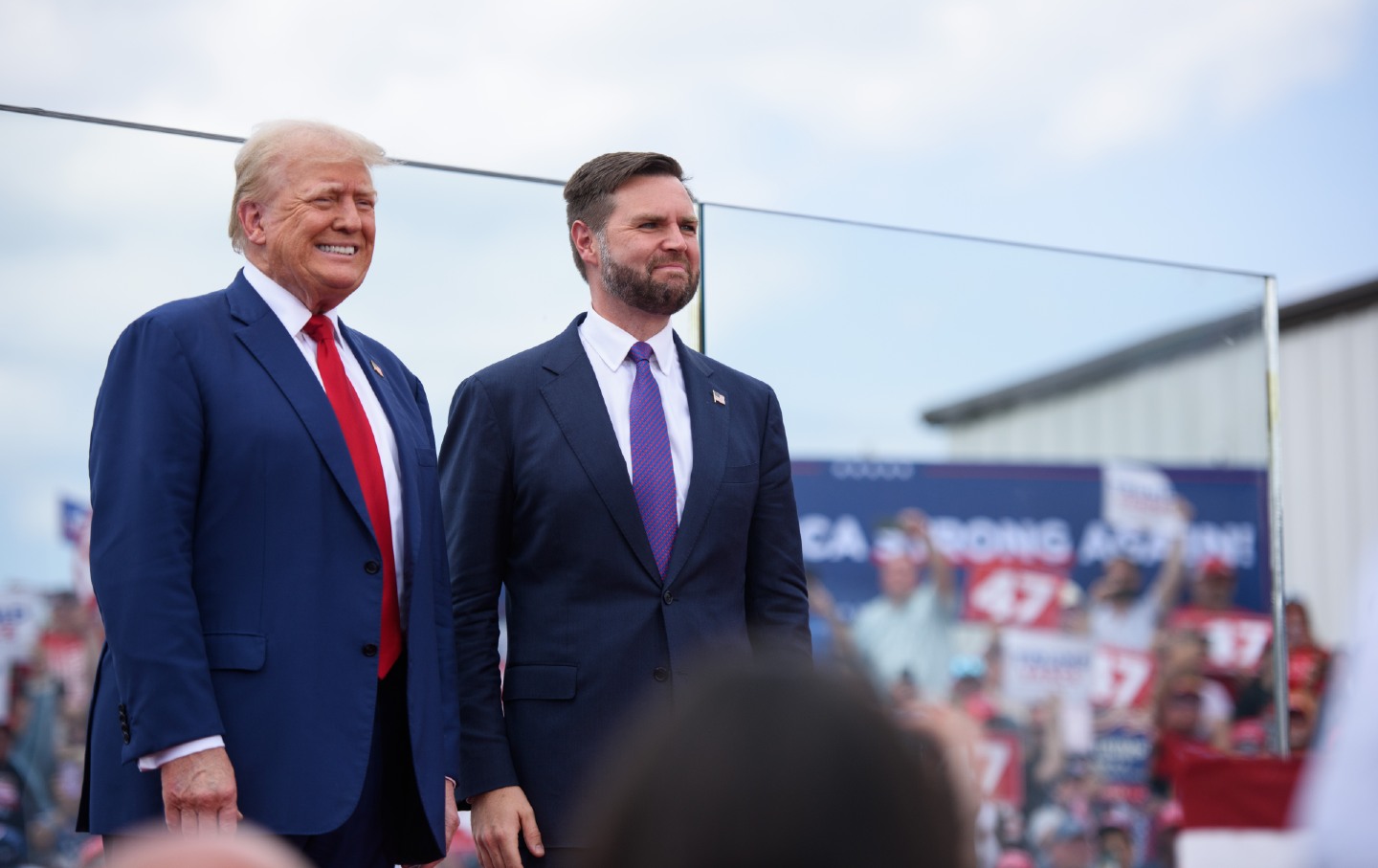 Donald Trump smiling next to J.D. Vance