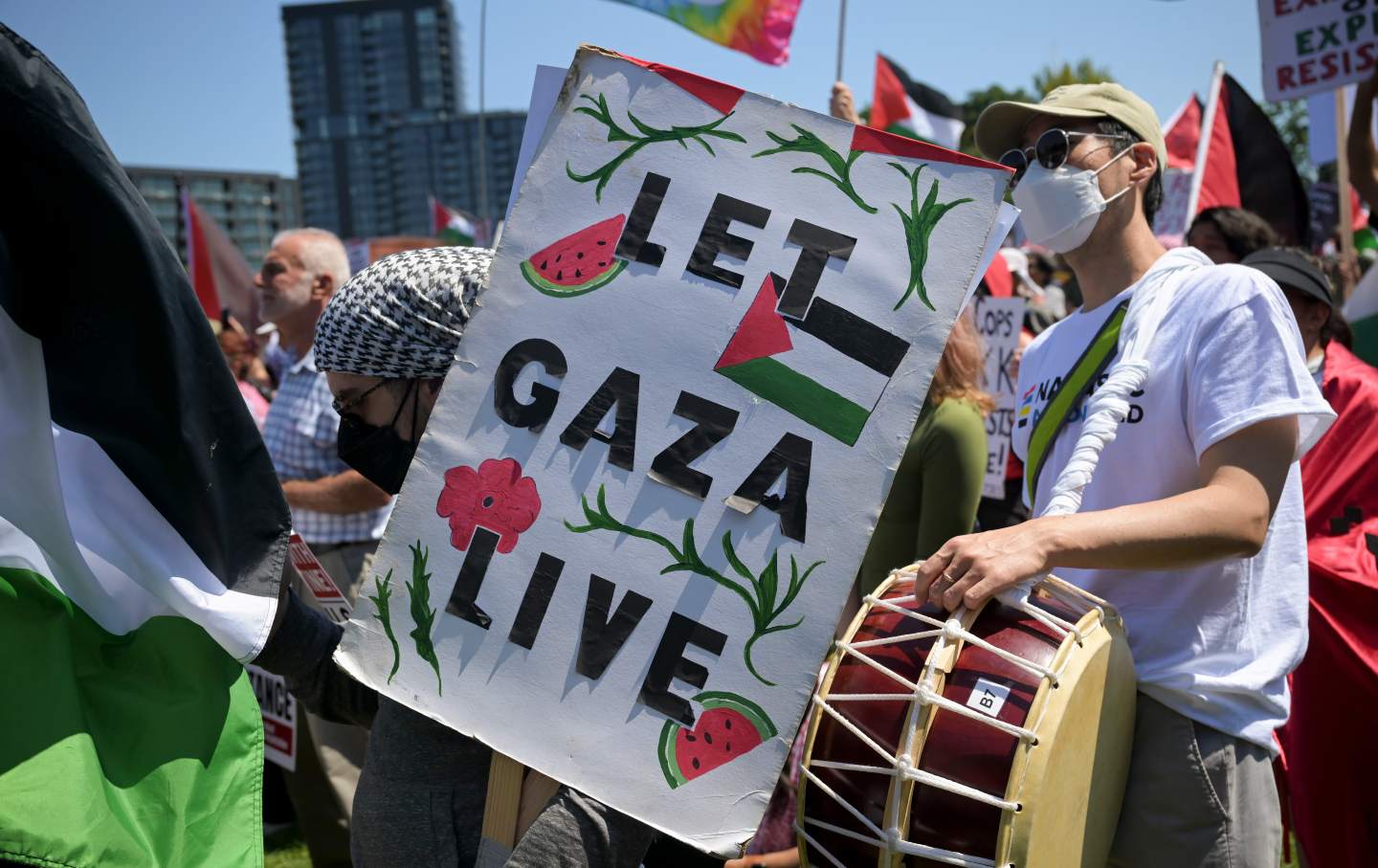 A demonstrator carries a sign ahead of the Democratic National Convention (DNC) near the United Center in Chicago, Illinois, on August 19, 2024.