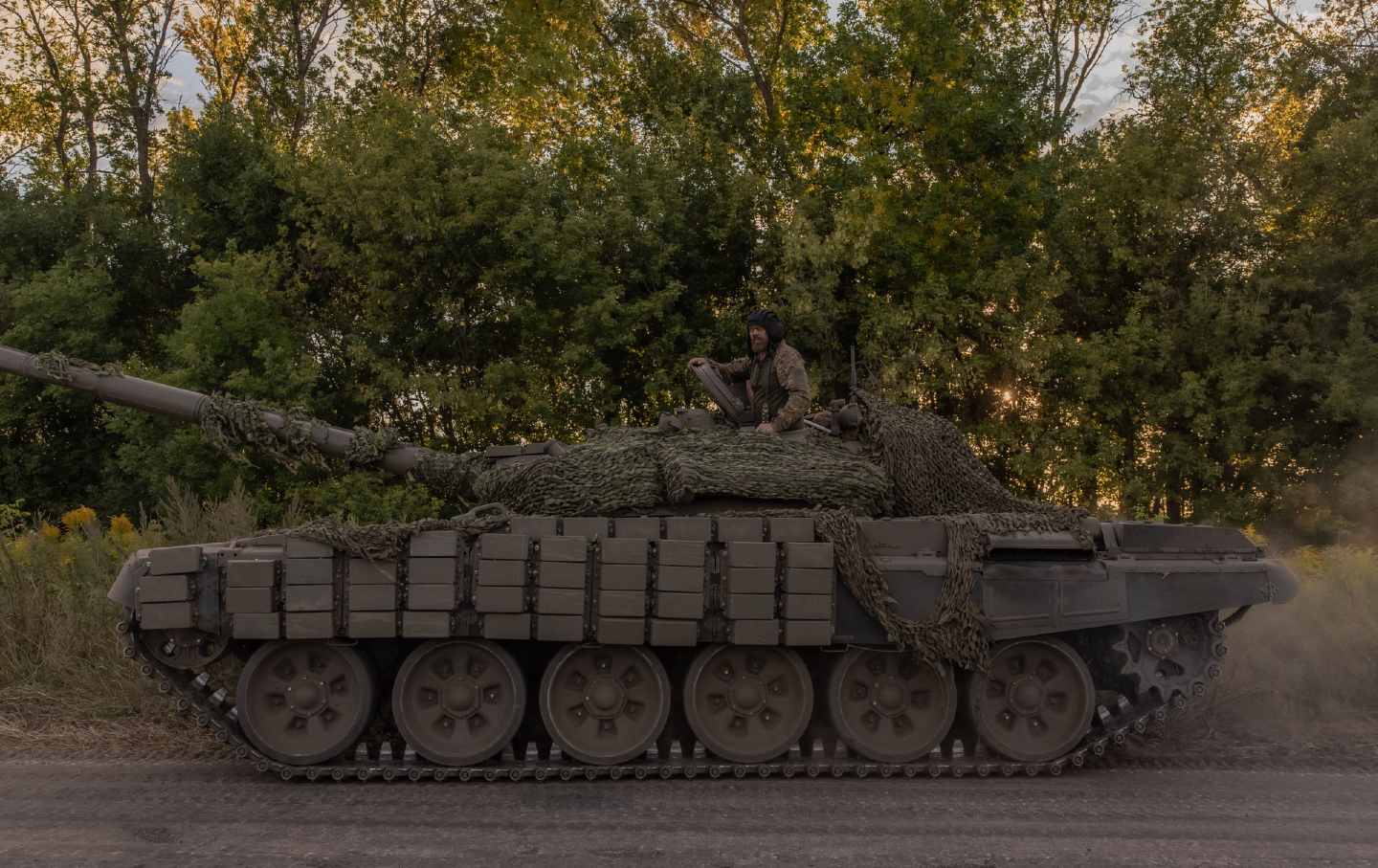 Ukrainian servicemen operate a Soviet-made T-72 tank in the Sumy region, near the border with Russia, on August 12, 2024, amid the Russian invasion of Ukraine.