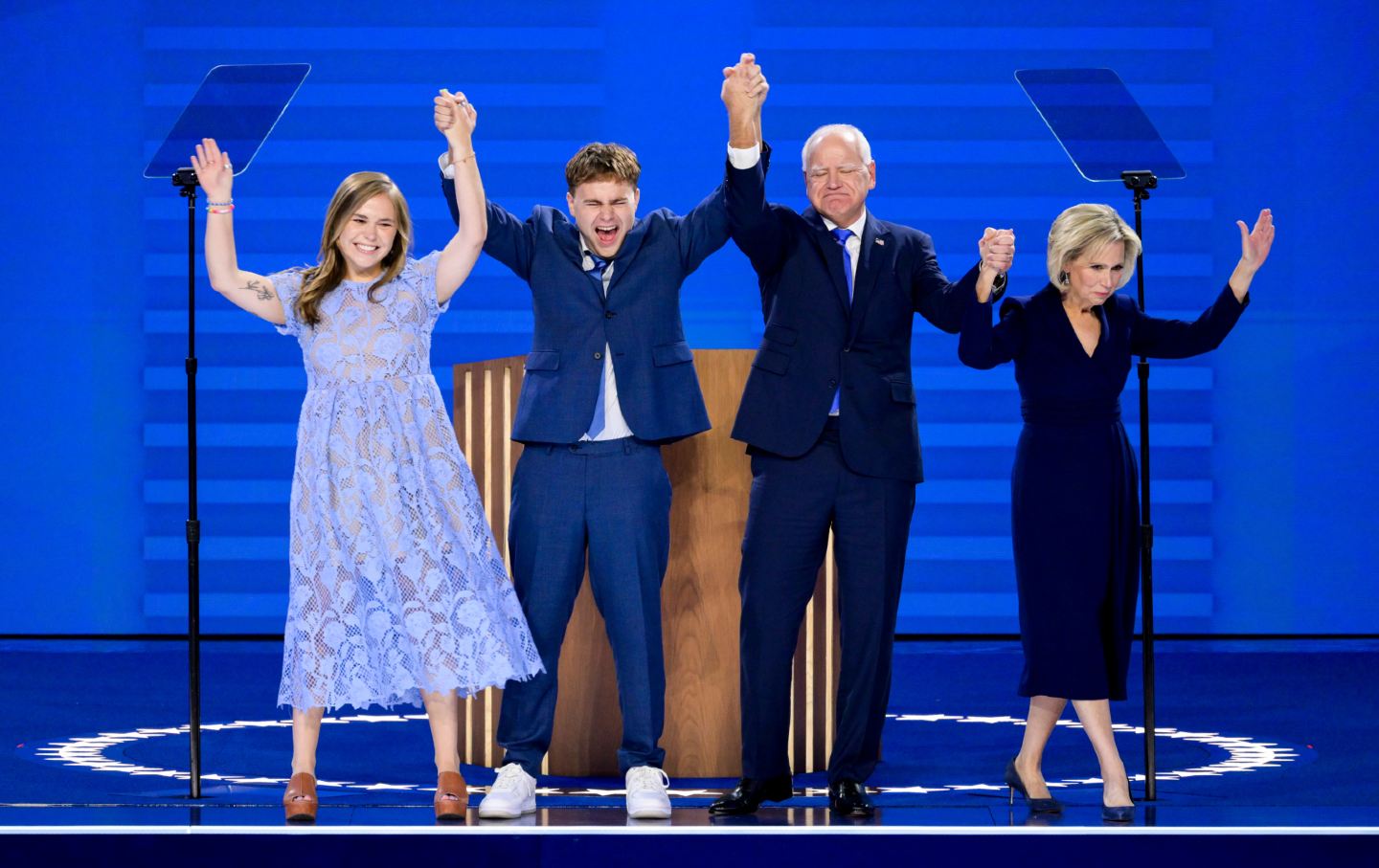 Tim Walz, governor of Minnesota and Democratic vice-presidential nominee, second right, joined by (from left) his daughter, Hope, his son, Gus, and his wife, Gwen, during the Democratic National Convention at the United Center in Chicago on August 21, 2024.