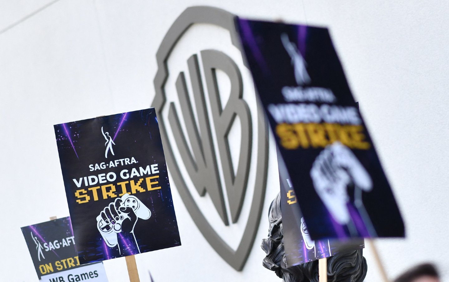 A sign held up at a union strike picket