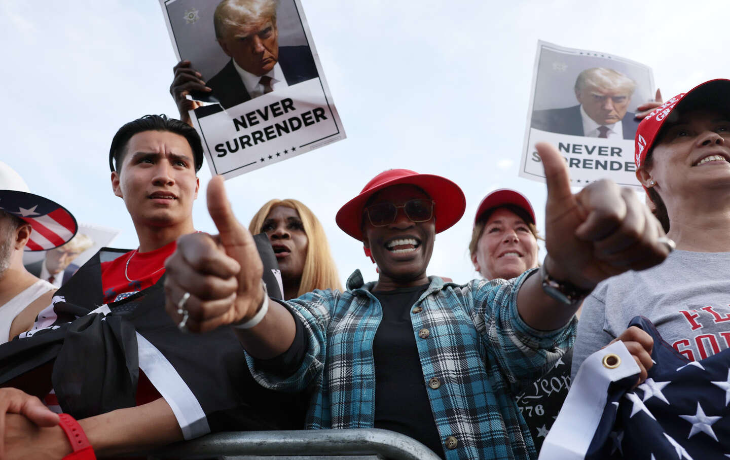 Supporters of former president Donald Trump watch as he holds a rally in the historical Democratic district of the South Bronx on May 23, 2024, in New York City.