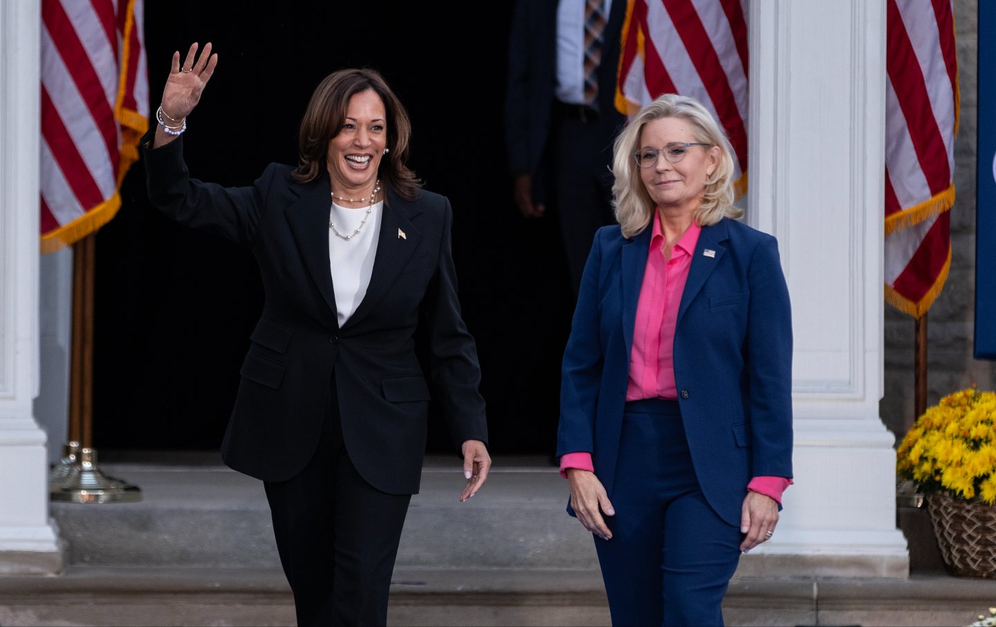 Kamala Harris walks with former U.S. Rep. Liz Cheney during a rally at Ripon College on October 3, 2024 in Ripon, Wisconsin.