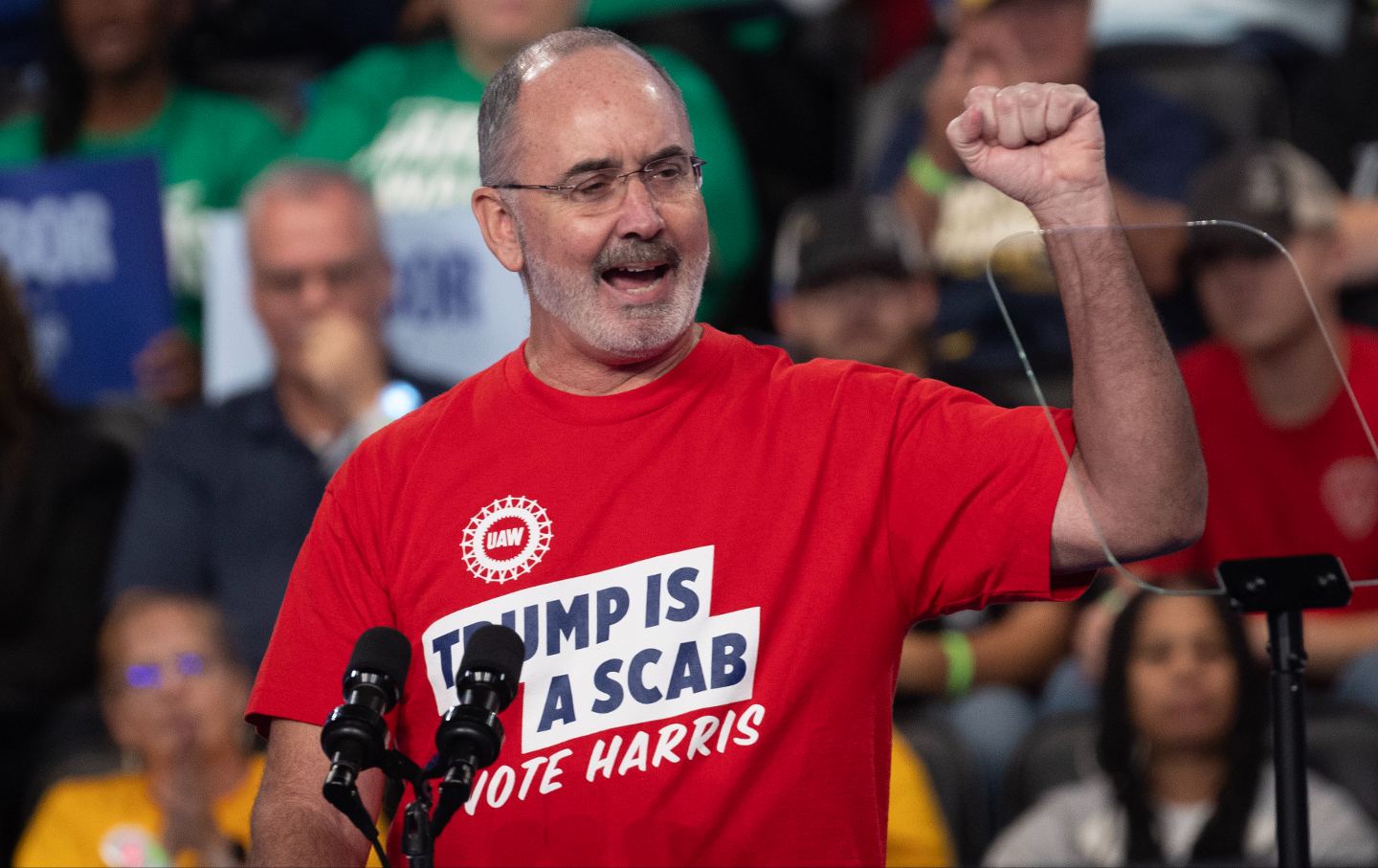 UAW president Shawn Fain speaks during a rally hosted by Democratic presidential nominee Vice President Kamala Harris at the Dort Financial Center on October 4, 2024, in Flint, Michigan.