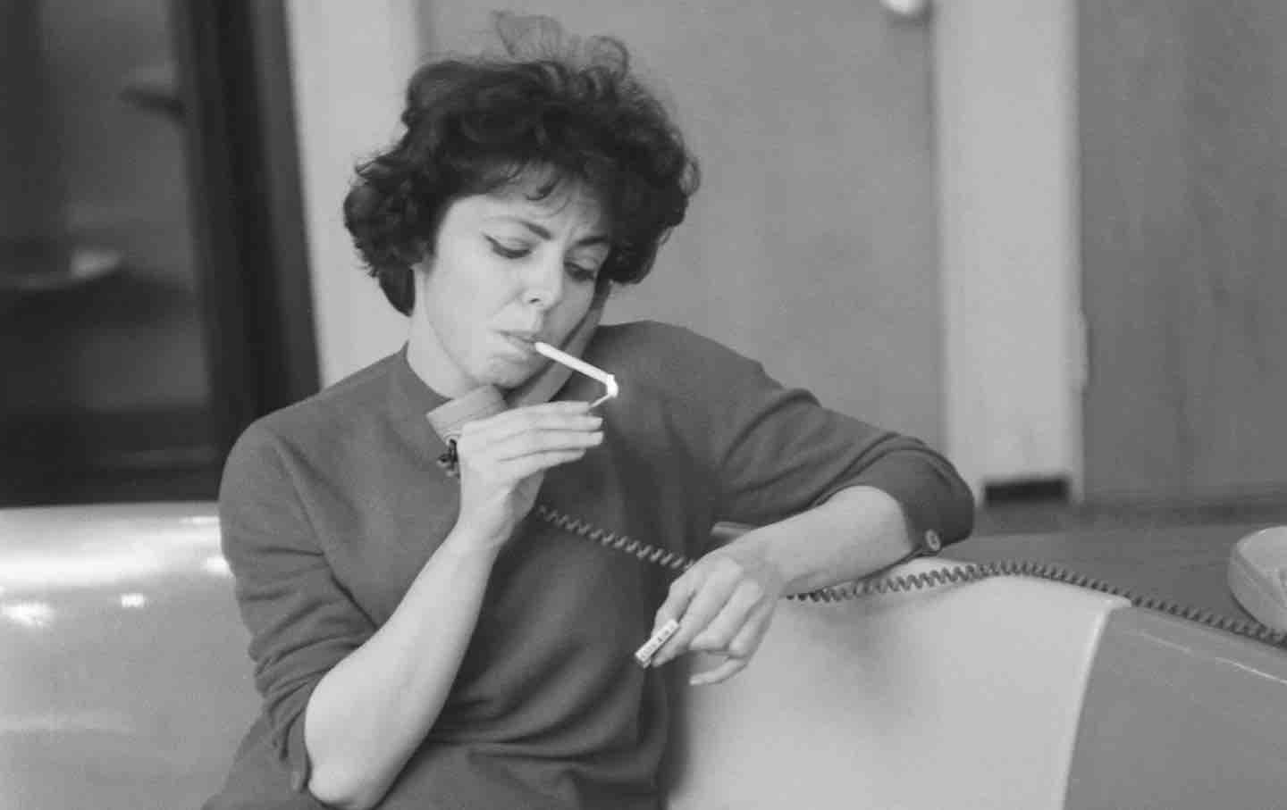 Elaine May poses for a portrait in a bowling alley in New York City, 1961.