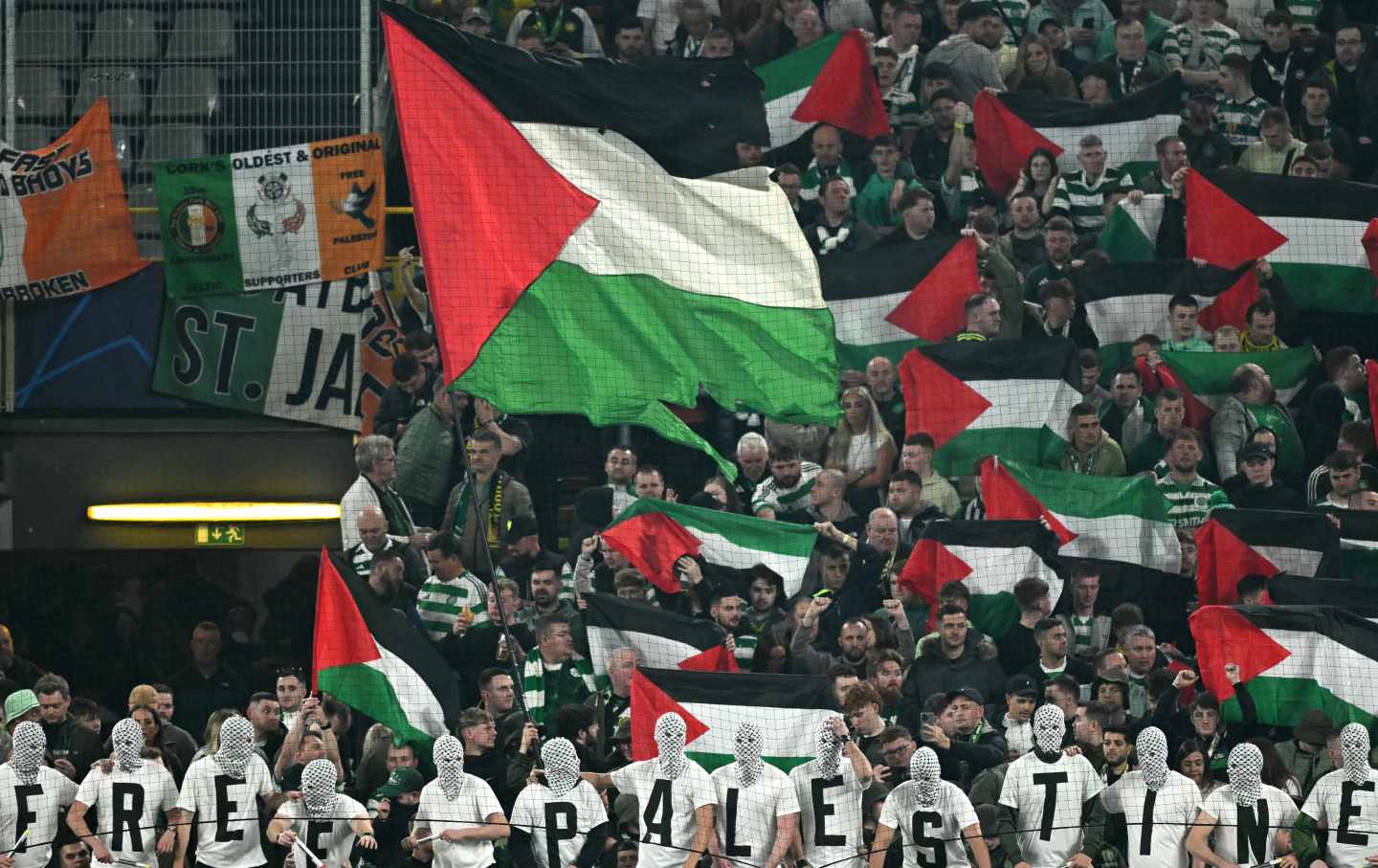 A sea of ​​Palestinian flags are waved by fans in the stands during the UEFA Champions League soccer match between Borussia Dortmund and Celtic in Dortmund, western Germany on October 1, 2024.