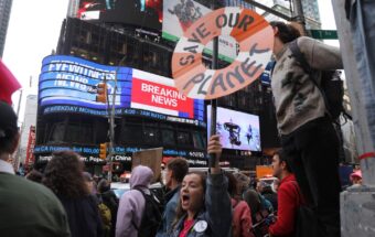 Protesters gather in Times Square as part of a protest by the environmental group Extinction Rebellion on October 10, 2019, in New York City.