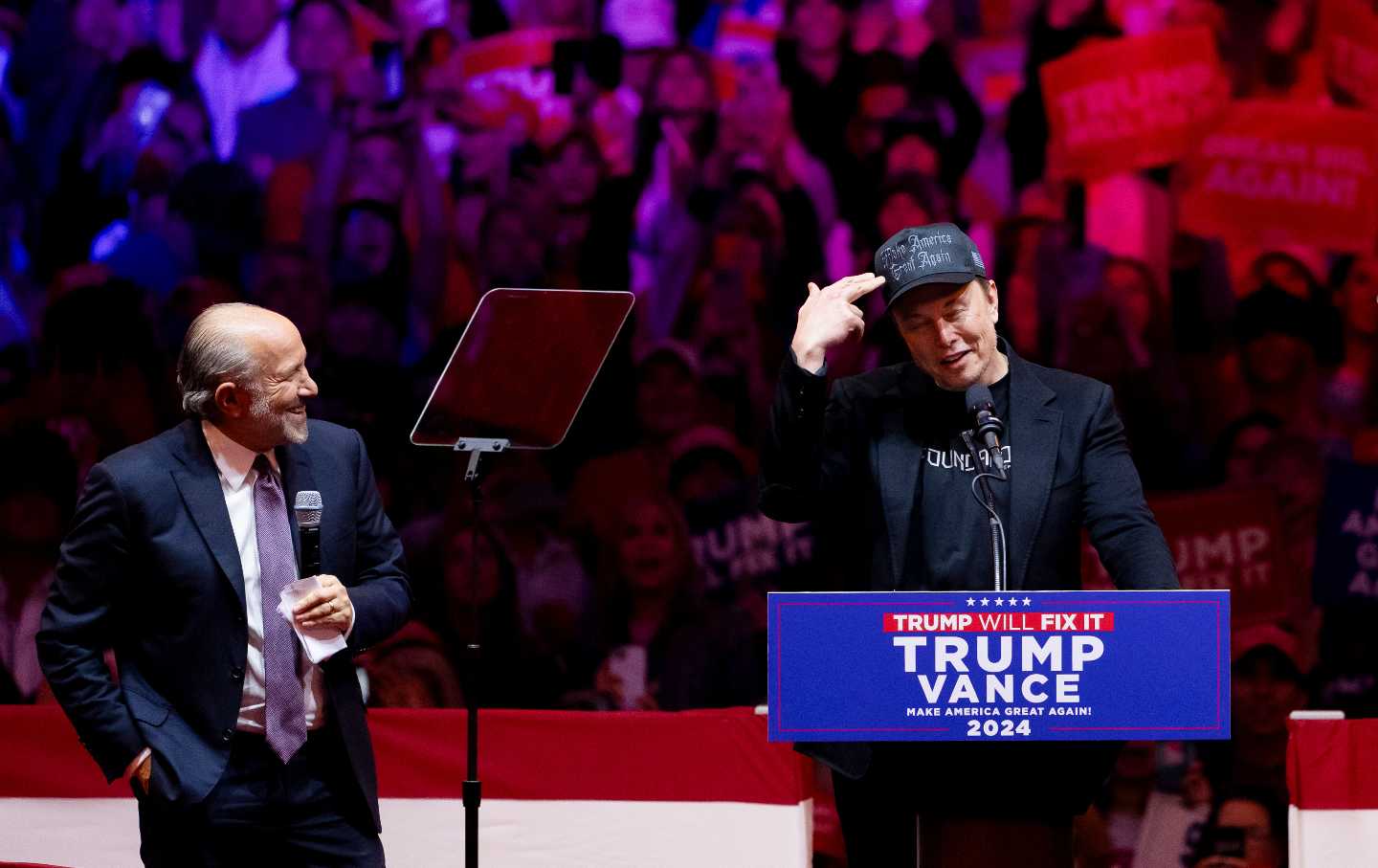 Howard Lutnick, chairman and chief executive officer of Cantor Fitzgerald LP (left) and Elon Musk during a campaign event with Donald Trump at Madison Square Garden on October 27, 2024.