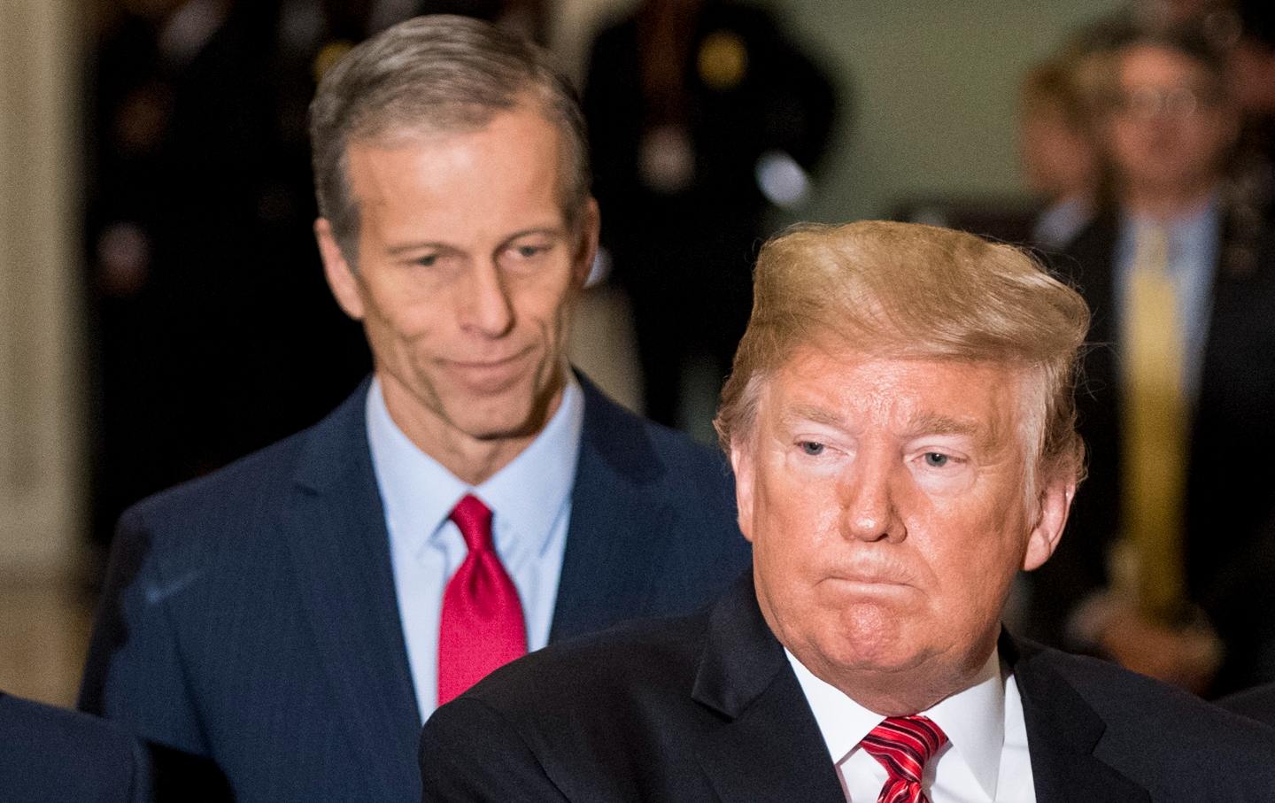 President Donald Trump, flanked by Sen. John Thune, stops to speak to the cameras following his lunch with Senate Republicans in the Capitol on Wed. Jan. 9, 2018.