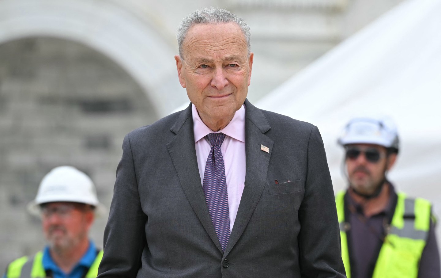 Senate majority leader Chuck Schumer (D-NY) participates in an event on September 18, 2024, on the lower west terrace of the US Capitol in Washington, DC, to hammer the first nails into the platform that will be built for the presidential inauguration.