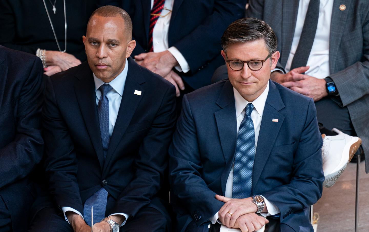 Hakeem Jeffries, a Democrat from New York, left, and US House Speaker Mike Johnson, a Republican from Louisiana, right, during an unveiling ceremony in Emancipation Hall at the US Capitol in Washington, DC, US, on Tuesday, Sept. 24, 2024.