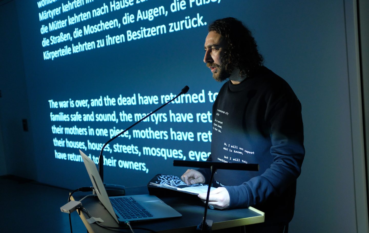 The poet Ghayath Almadhoun reads from “N-O-T M-Y P-O-E-SM-S” at the DAAD Gallery on February 19, 2020, in Berlin, Germany.