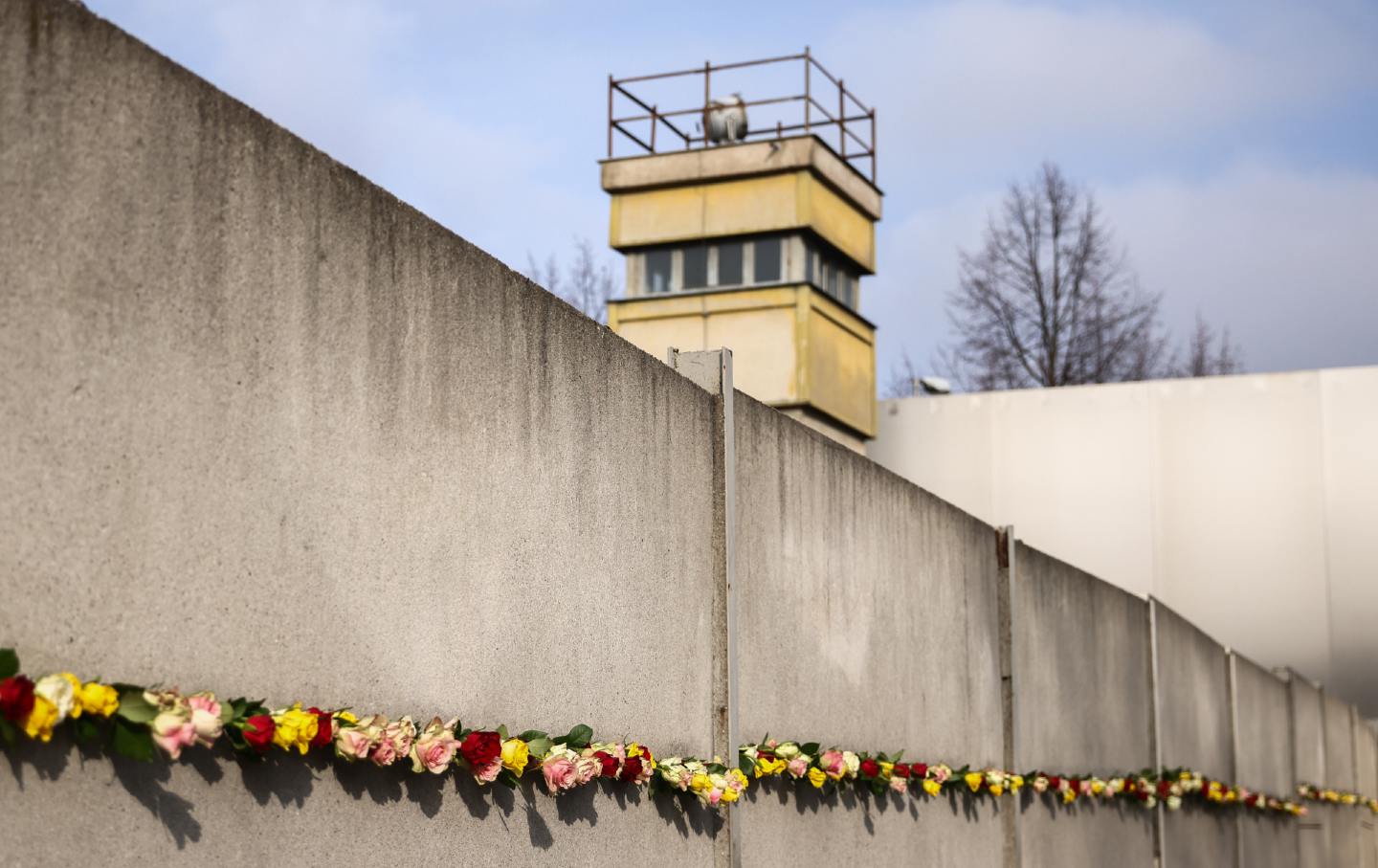 Flowers at the Berlin Wall Memorial after the commemoration ceremony marking the 35th anniversary of the fall of the Berlin Wall. Berlin, Germany, on November 9, 2024.