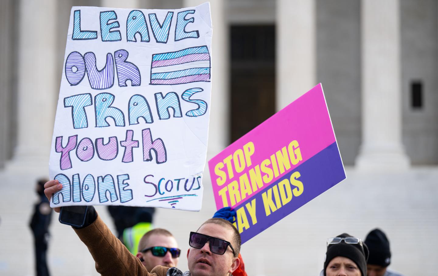 Activists for and against trans rights protest outside the Supreme Court Building before the start of the United States v. Skrmetti case on December 4, 2024.