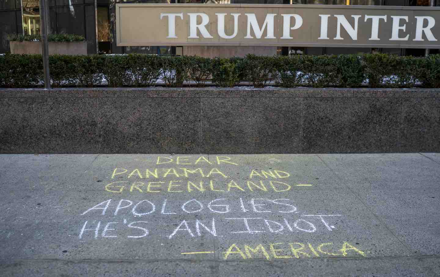 Graffiti on the sidewalk at the Trump International Hotel on December 23, 2024, in New York City.