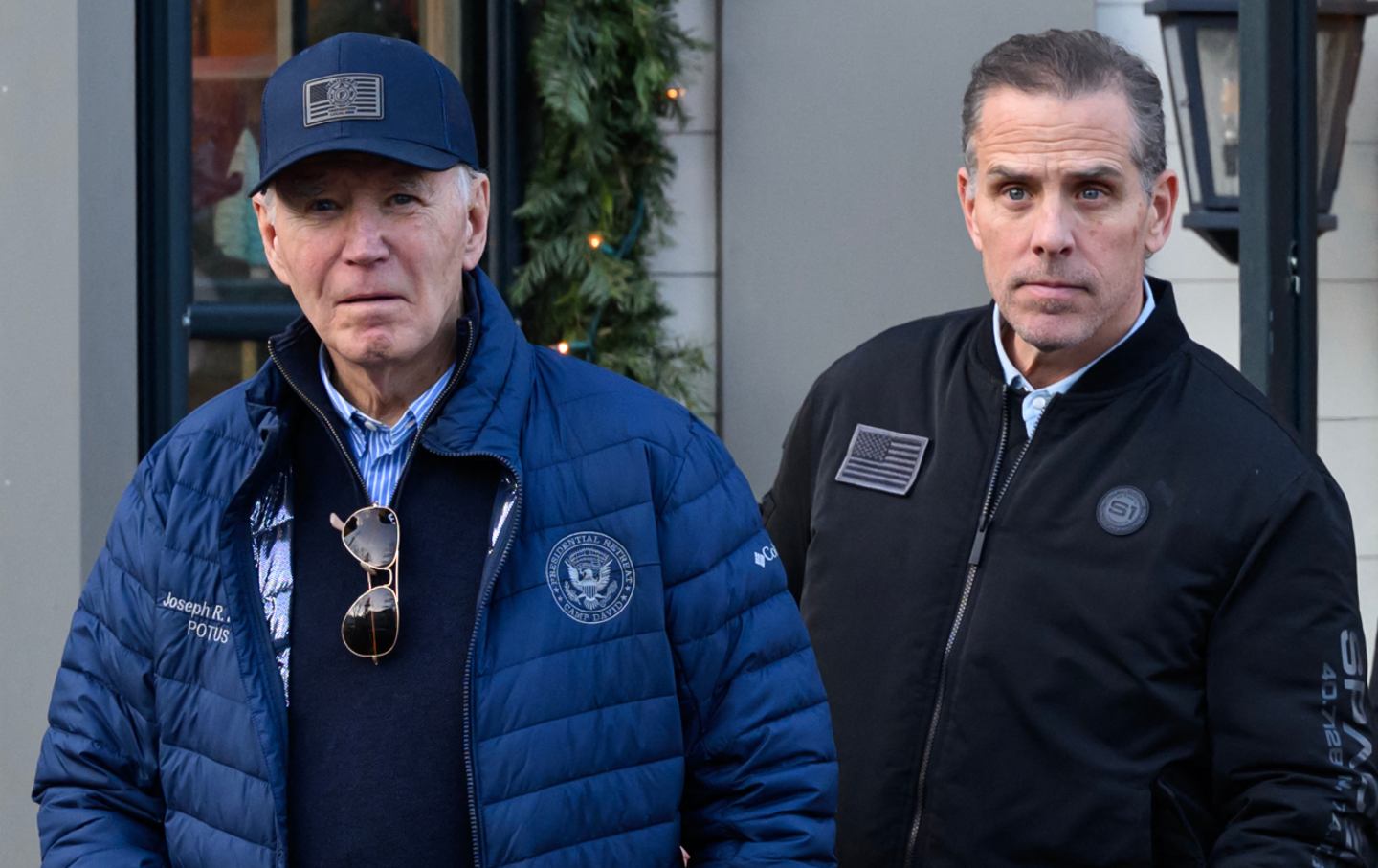 President Joe Biden and son Hunter Biden stepping out of a bookstore while shopping in Nantucket, Massachusetts, on November 29, 2024. Biden on Sunday issued an official pardon for his son Hunter, who is facing sentencing for two criminal cases related to tax evasion and the purchase of a firearm.