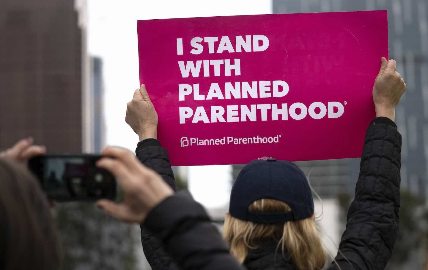 An activist holds a placard that says “I Stand with Planned Parenthood” during a rally in Los Angeles on May 21, 2019.