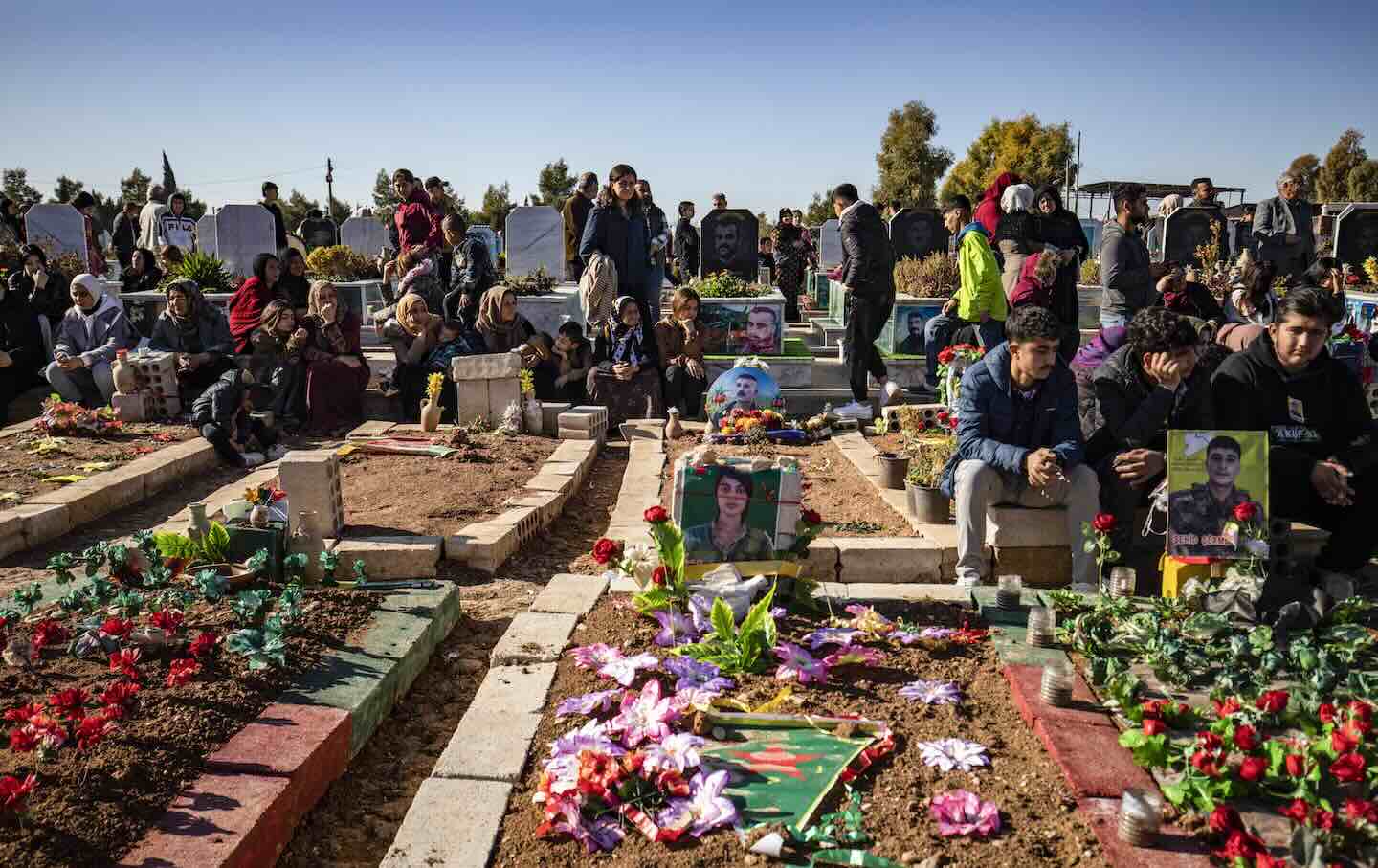 Mourners attend the funeral in Qamishly of two Kurdish Syrian Democratic Forces fighters, killed days earlier in battle with Turkish-backed Syrian forces in the northern city of Manbij, on January 2, 2025.