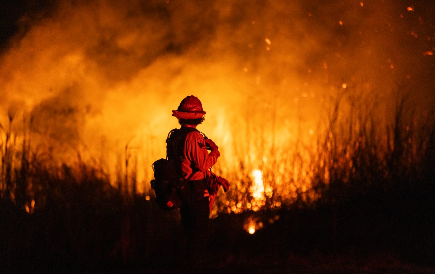 A firefighter monitors the spread of the Auto Fire in Oxnard, North West of Los Angeles, California, on January 13, 2025.