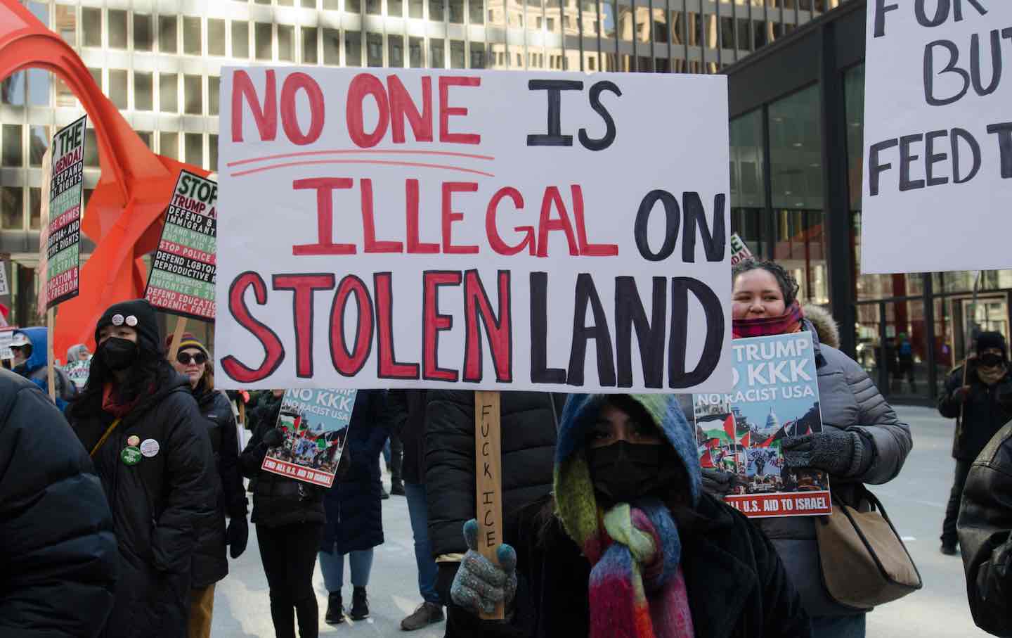 Protesters march through downtown Chicago, opposing Donald Trump's presidential inauguration on January 20, 2025.